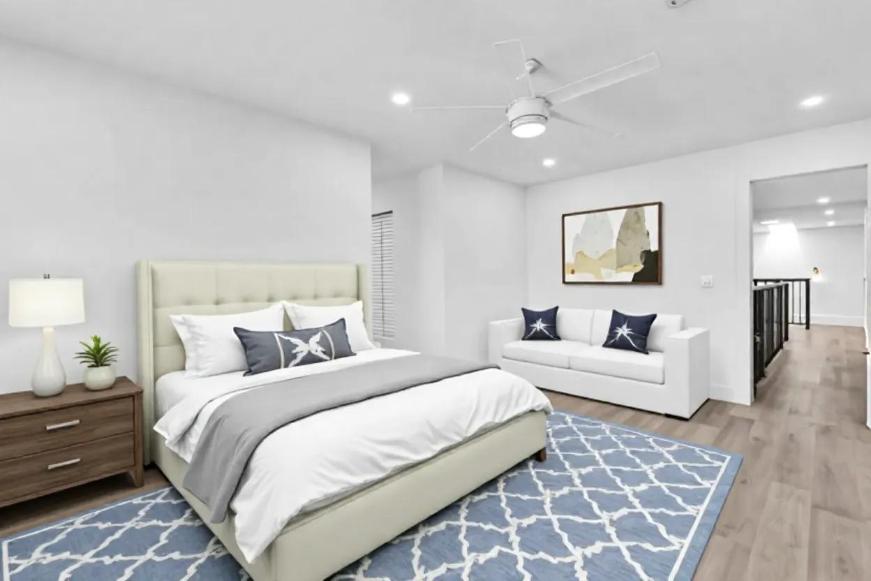 6565 Parkview Drive, Unit C Boca Raton, FL 33433 - Photo 12 of 40 a bedroom with a large bed and a couch