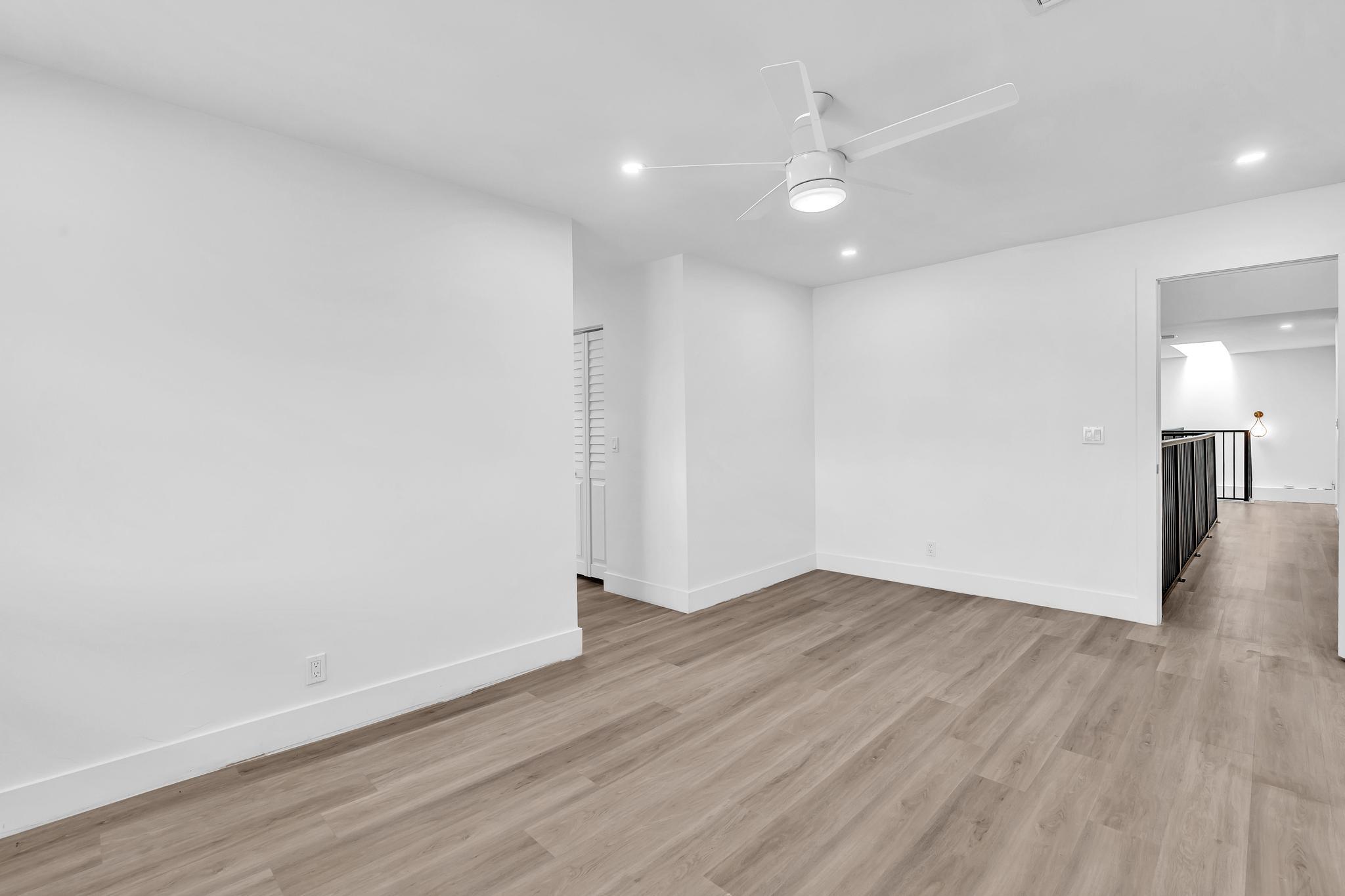 6565 Parkview Drive, Unit C Boca Raton, FL 33433 - Photo 13 of 40 a view of an empty room with wooden floor