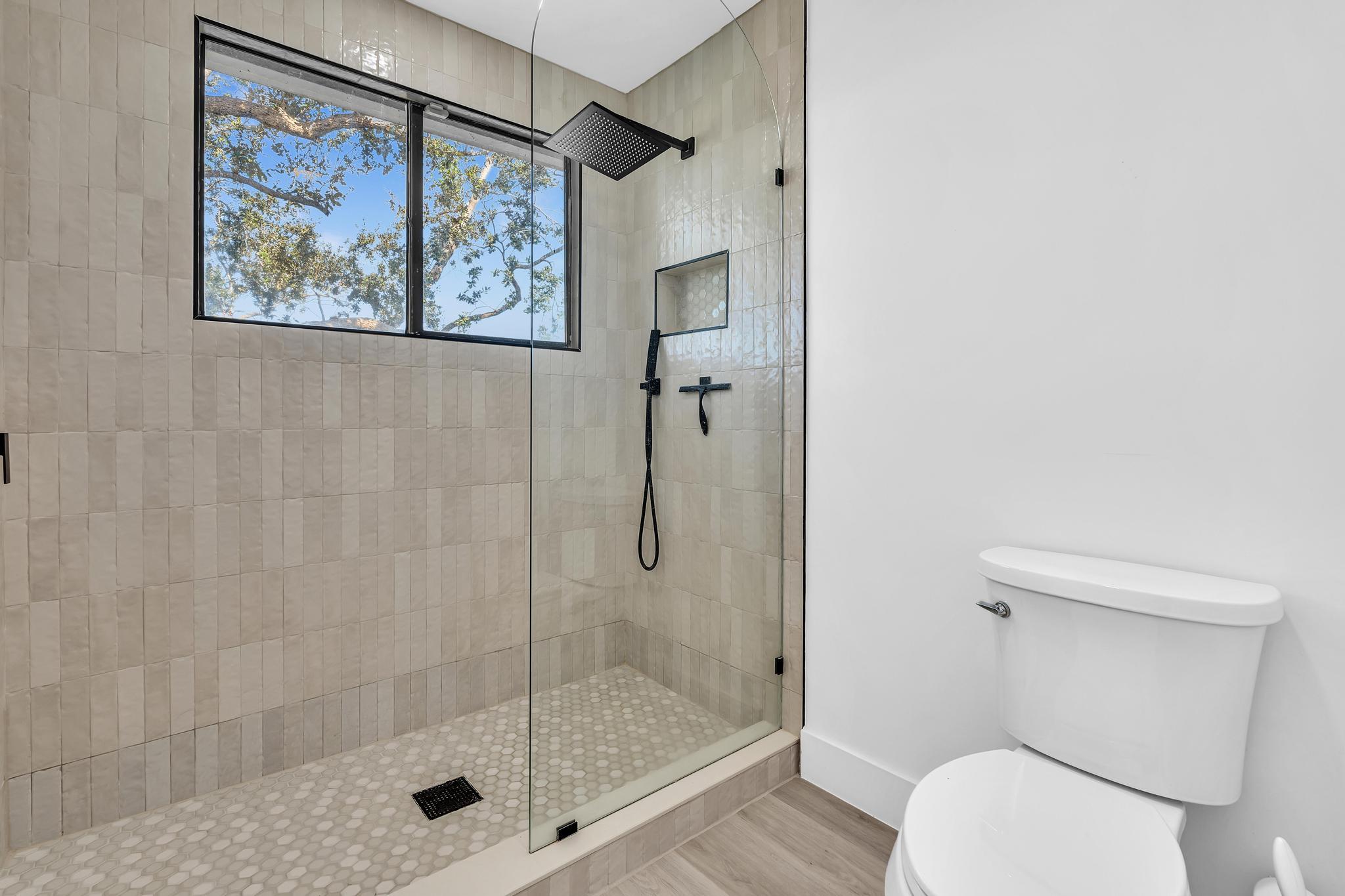 6565 Parkview Drive, Unit C Boca Raton, FL 33433 - Photo 17 of 40 a bathroom with a shower and toilet