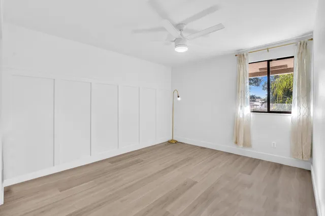 a bathroom with a toilet a sink and a mirror