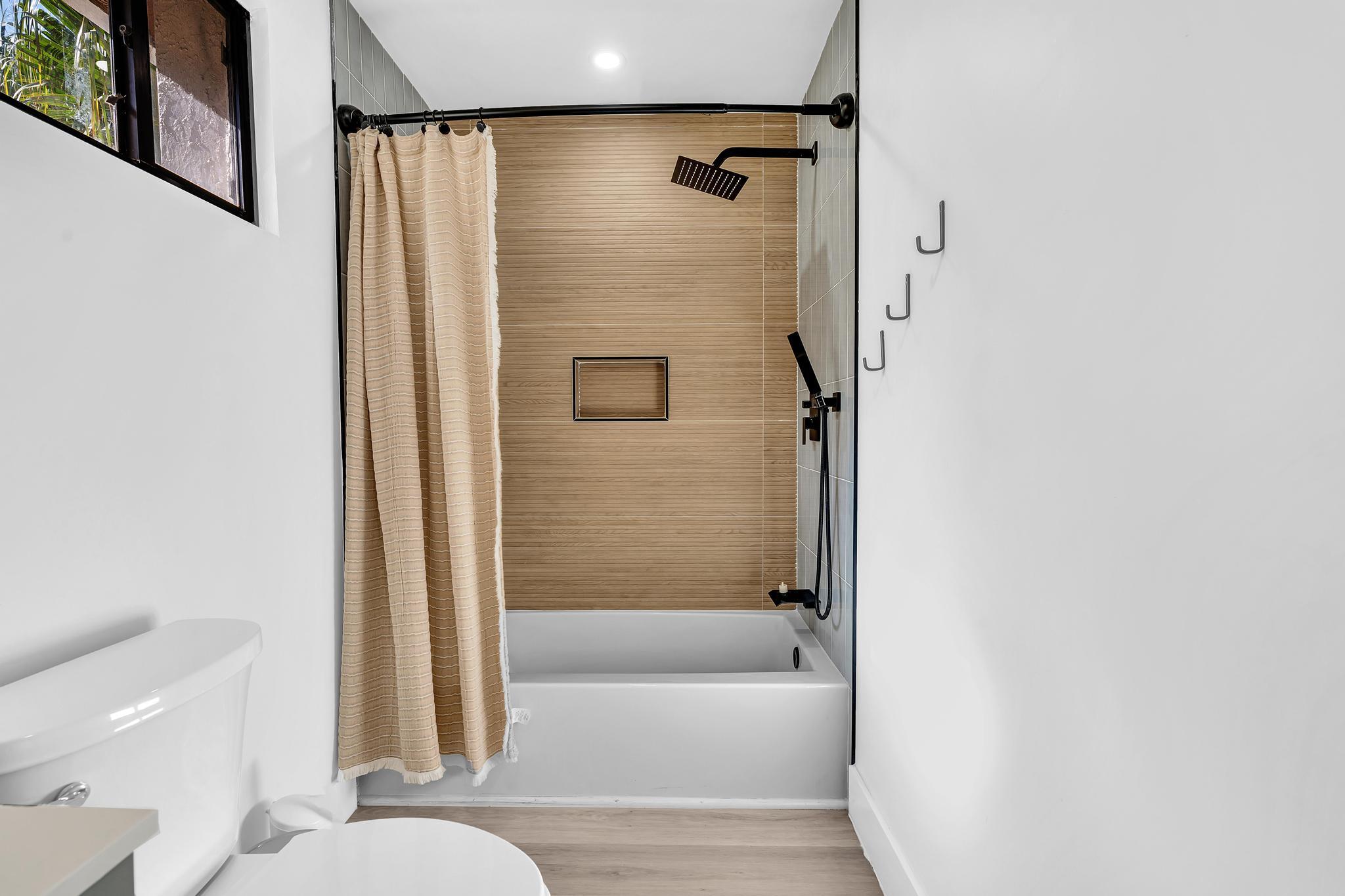 6565 Parkview Drive, Unit C Boca Raton, FL 33433 - Photo 21 of 40 a bathroom with a bathtub and a shower