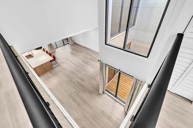 a bedroom with a bed and a mirror