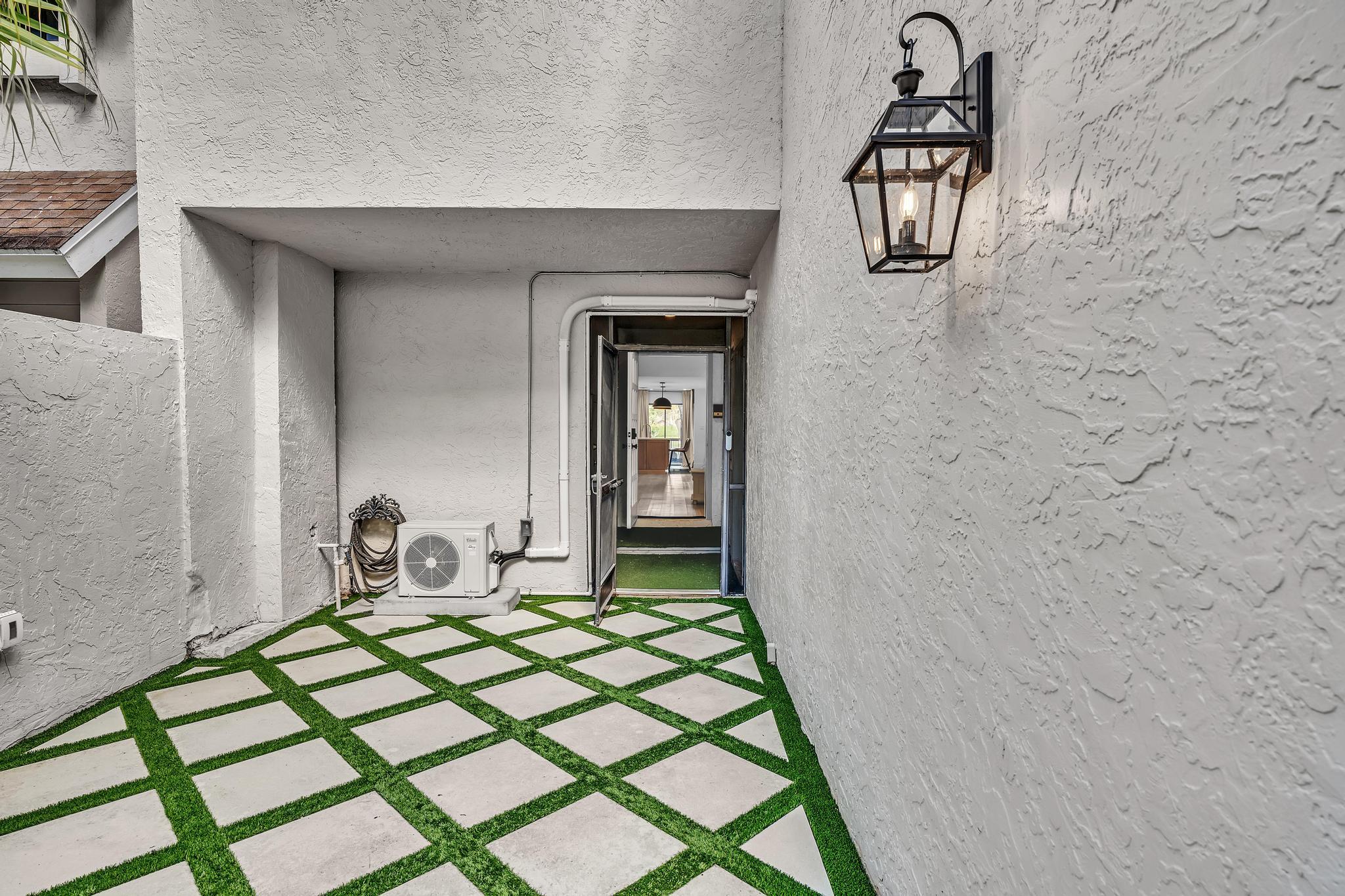 6565 Parkview Drive, Unit C Boca Raton, FL 33433 - Photo 27 of 40 a bedroom with a bed and a mirror