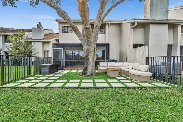 an aerial view of a house with a lake view