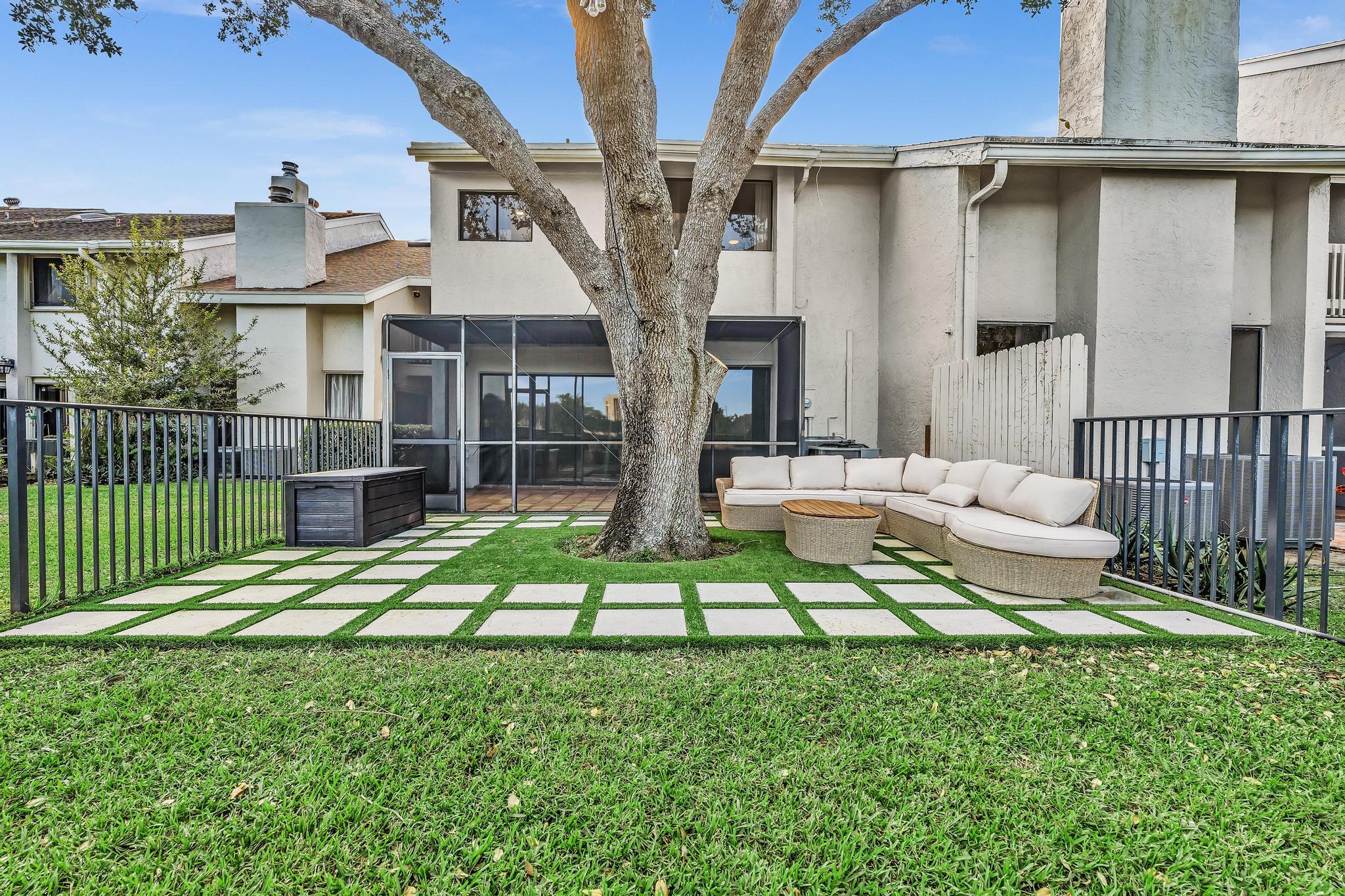6565 Parkview Drive, Unit C Boca Raton, FL 33433 - Photo 32 of 40 a view of house with backyard porch and garden