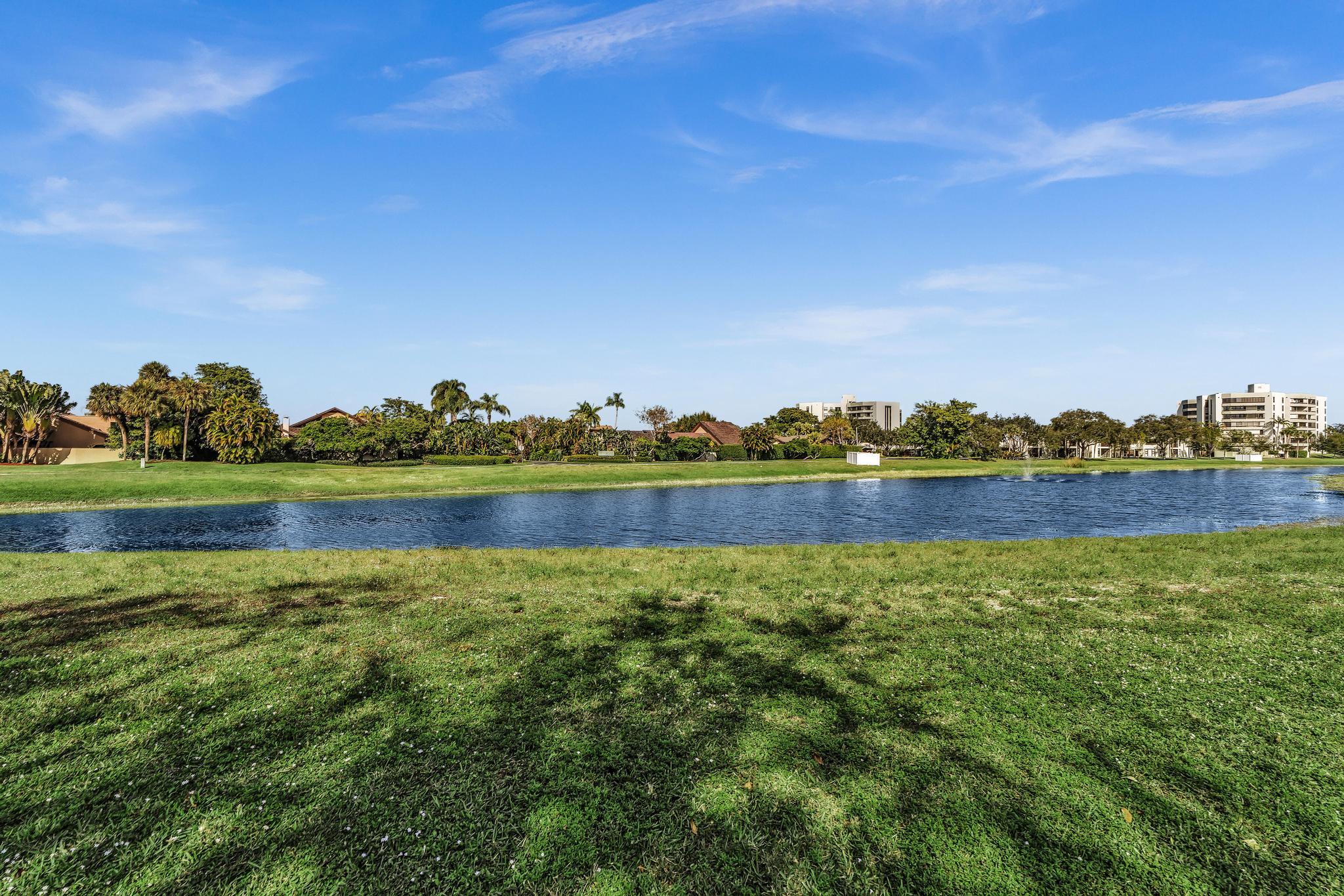 6565 Parkview Drive, Unit C Boca Raton, FL 33433 - Photo 33 of 40 a view of a lake with houses in the back
