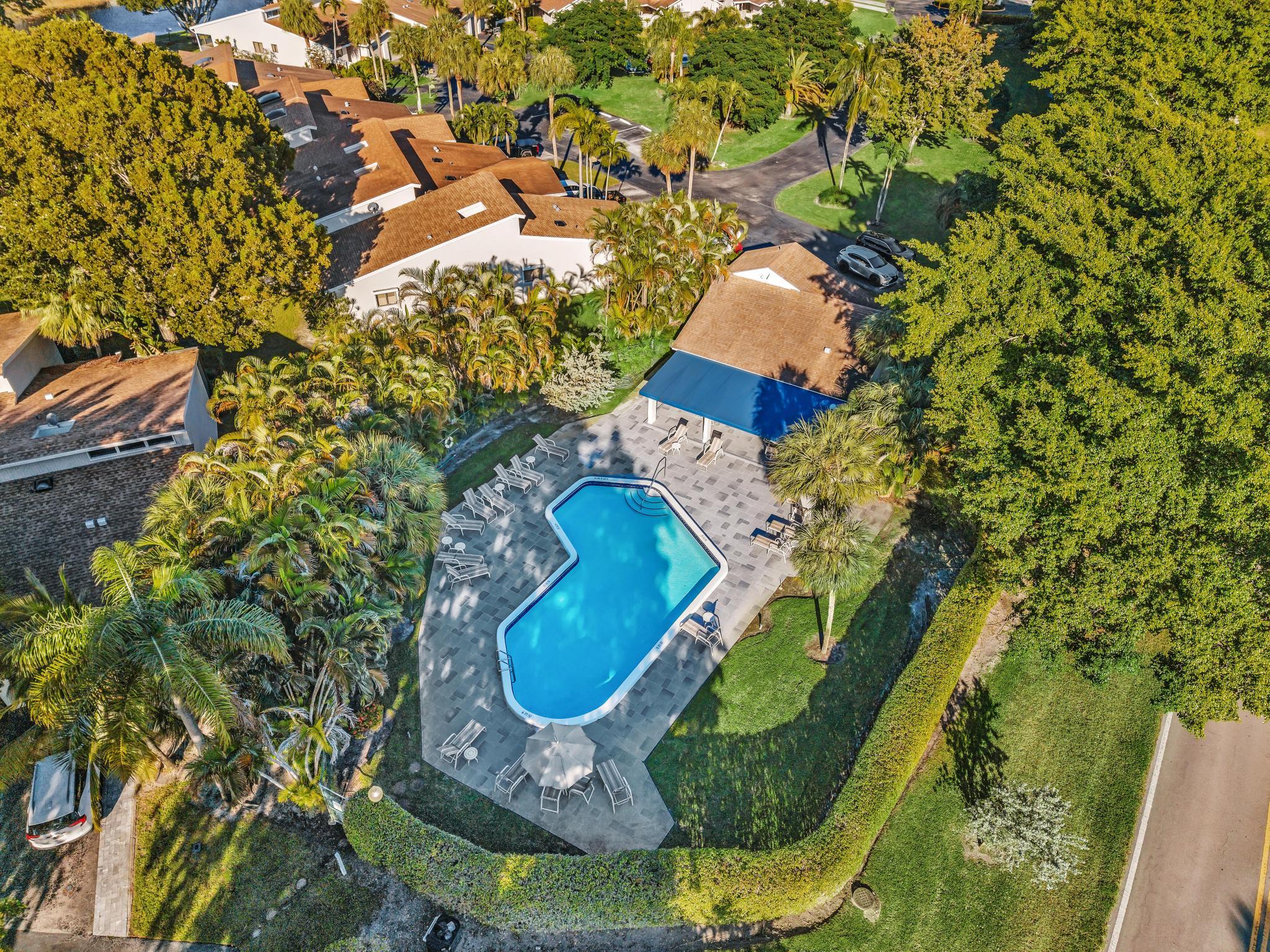 6565 Parkview Drive, Unit C Boca Raton, FL 33433 - Photo 35 of 40 an aerial view of a house with swimming pool and garden view