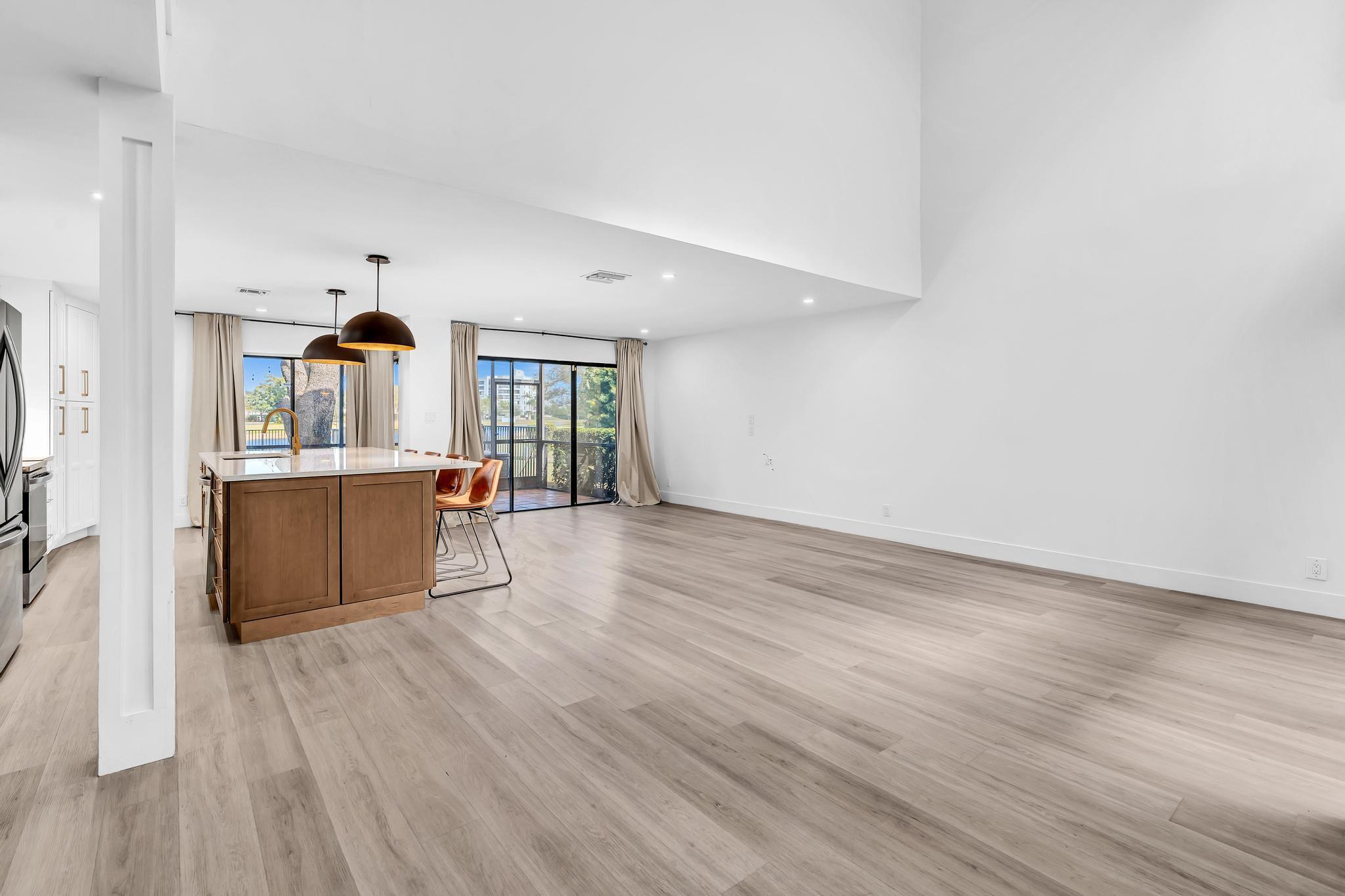 6565 Parkview Drive, Unit C Boca Raton, FL 33433 - Photo 8 of 40 a view of a kitchen with wooden floor and cabinets
