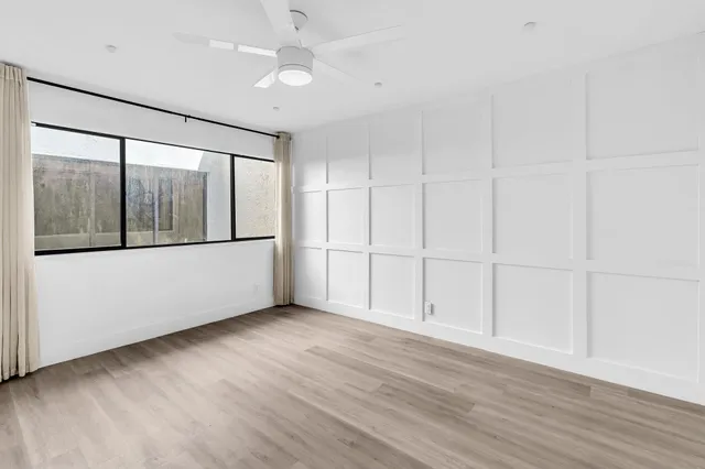 a bedroom with a large bed and a couch