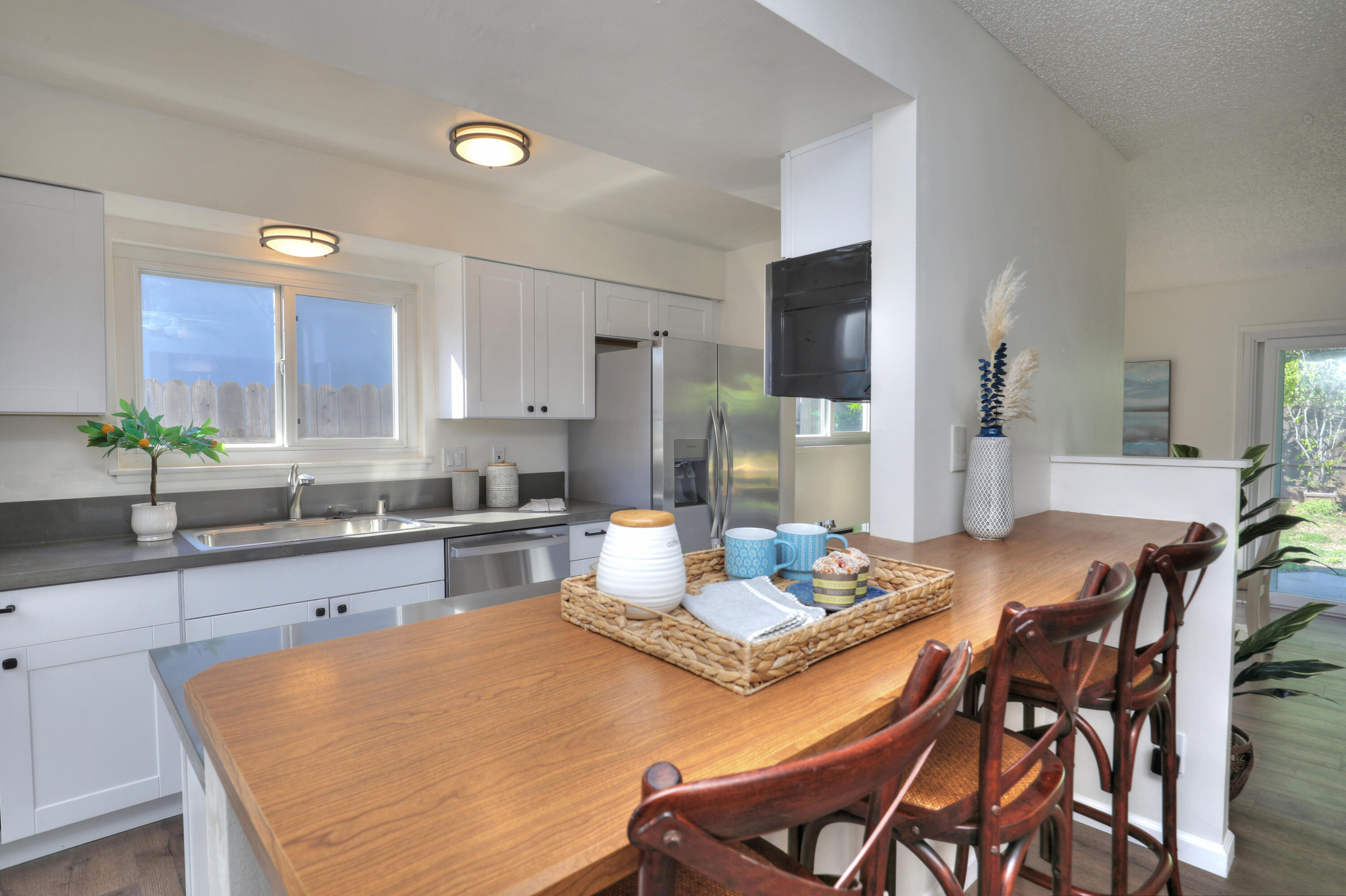 3704 Capri Drive Santa Barbara, CA 93105 - Photo 15 of 33 a kitchen with a table and chairs in it