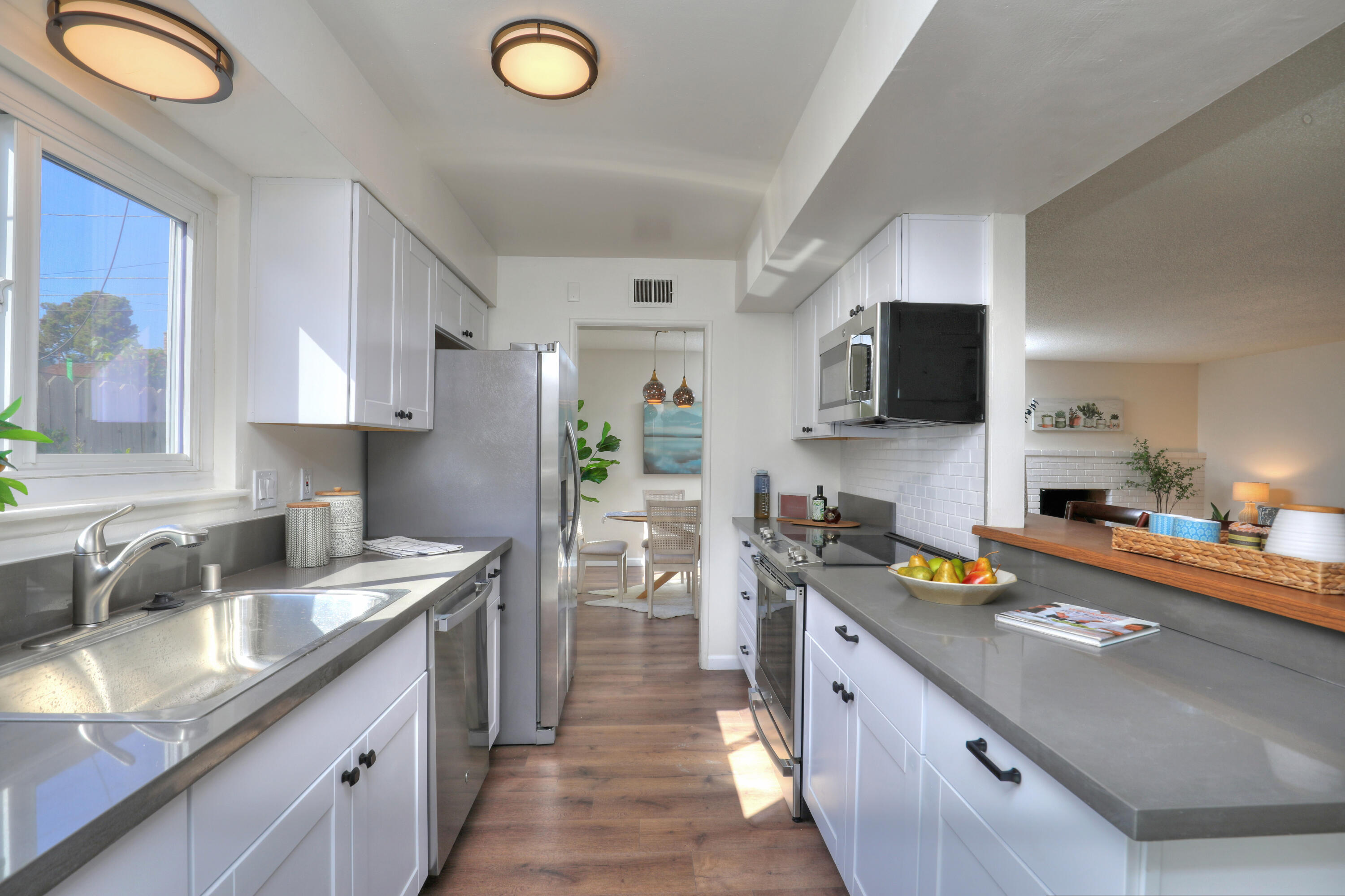3704 Capri Drive Santa Barbara, CA 93105 - Photo 19 of 33 a kitchen with stainless steel appliances granite countertop a sink stove and refrigerator