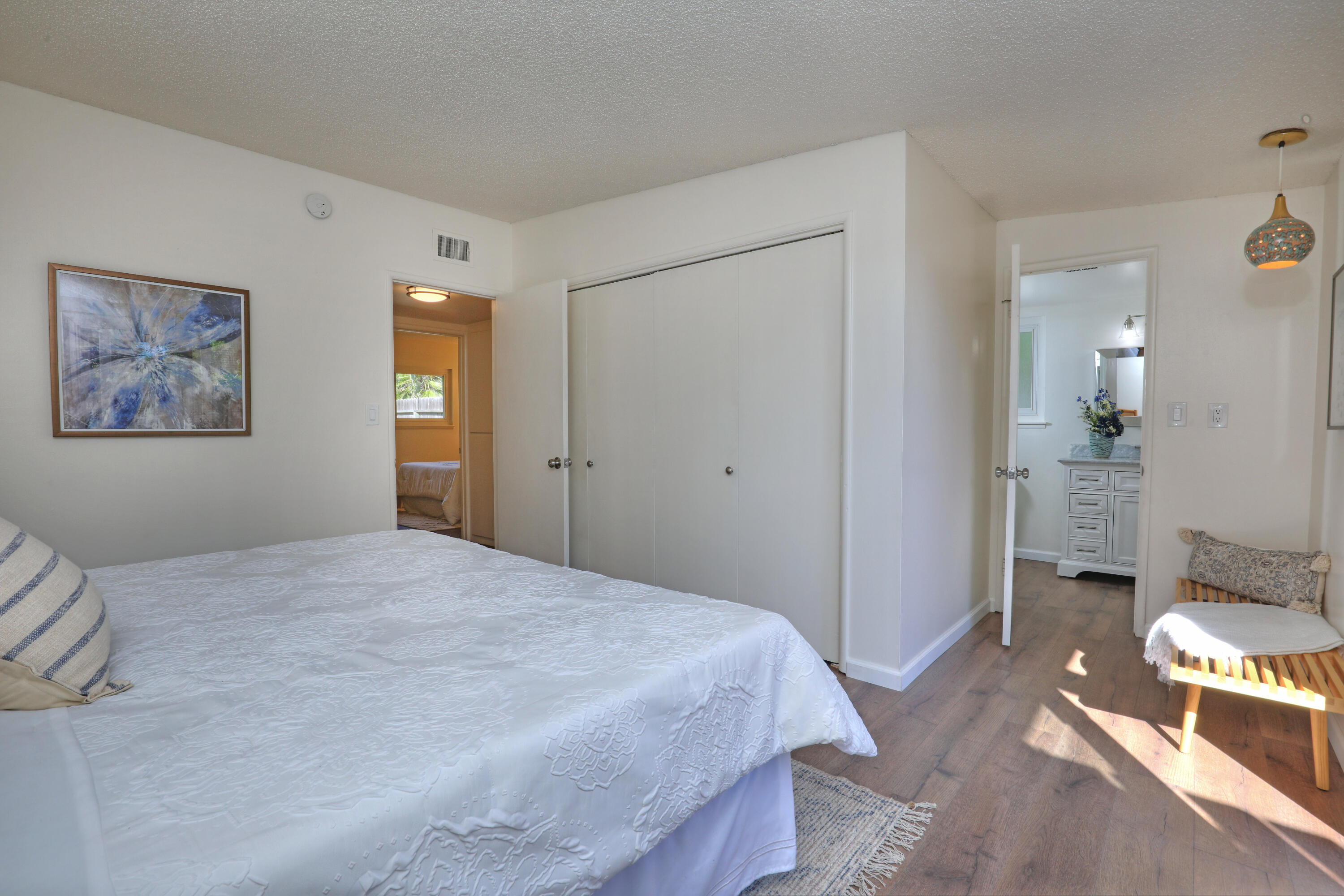 3704 Capri Drive Santa Barbara, CA 93105 - Photo 23 of 33 a bedroom with a bed and a table