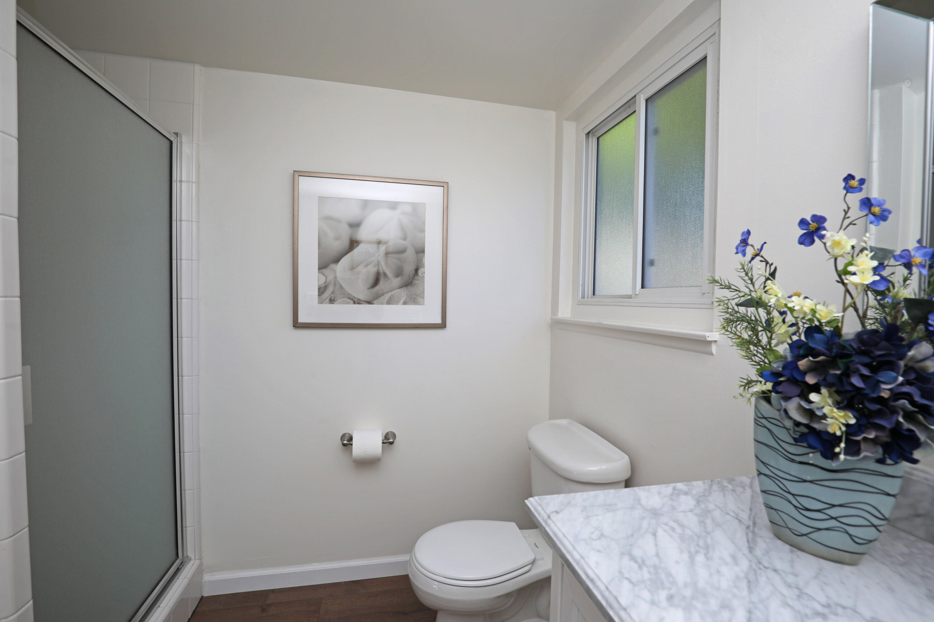 3704 Capri Drive Santa Barbara, CA 93105 - Photo 26 of 33 a bathroom with a toilet a sink and a window