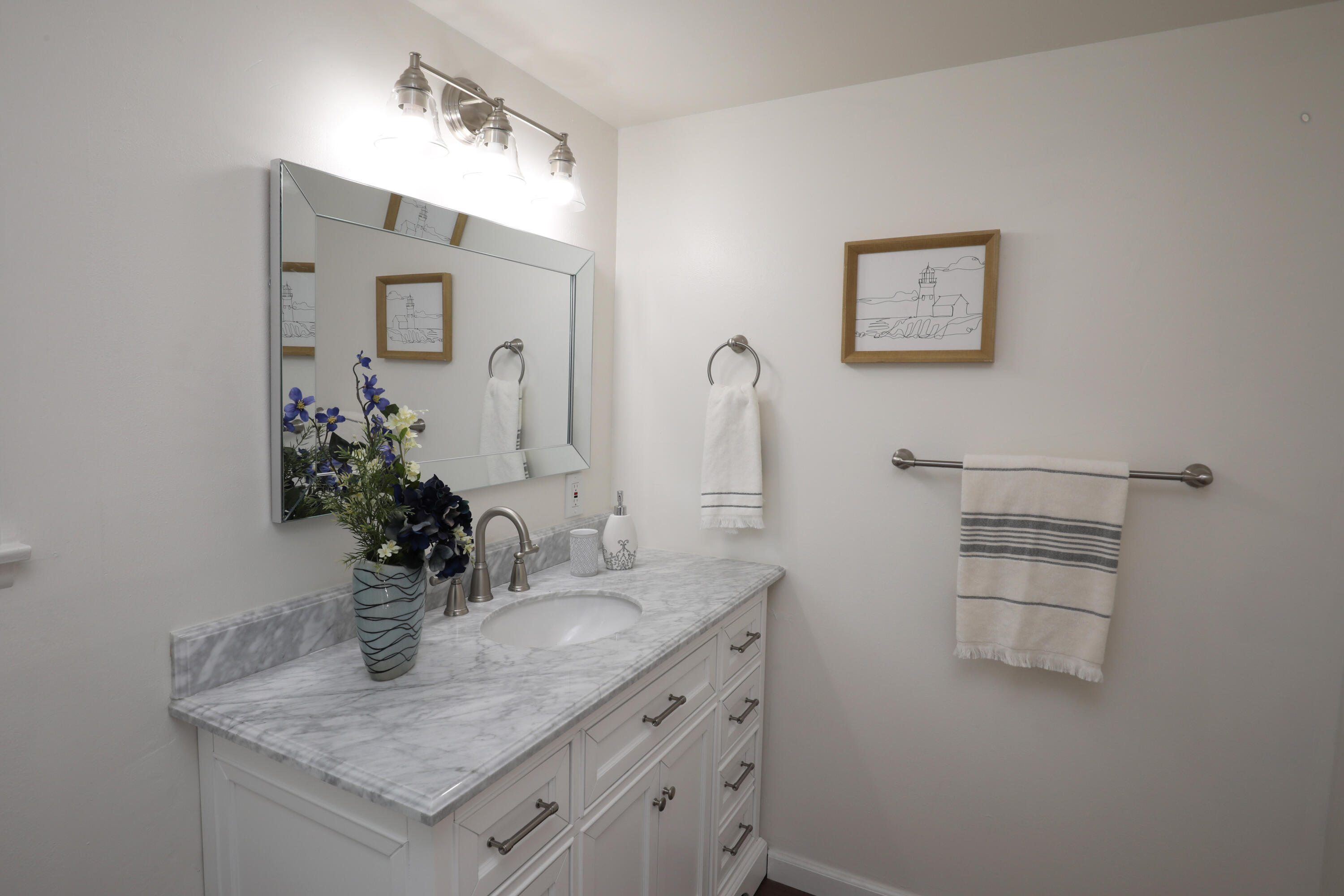3704 Capri Drive Santa Barbara, CA 93105 - Photo 27 of 33 a bathroom with a granite countertop sink and a mirror