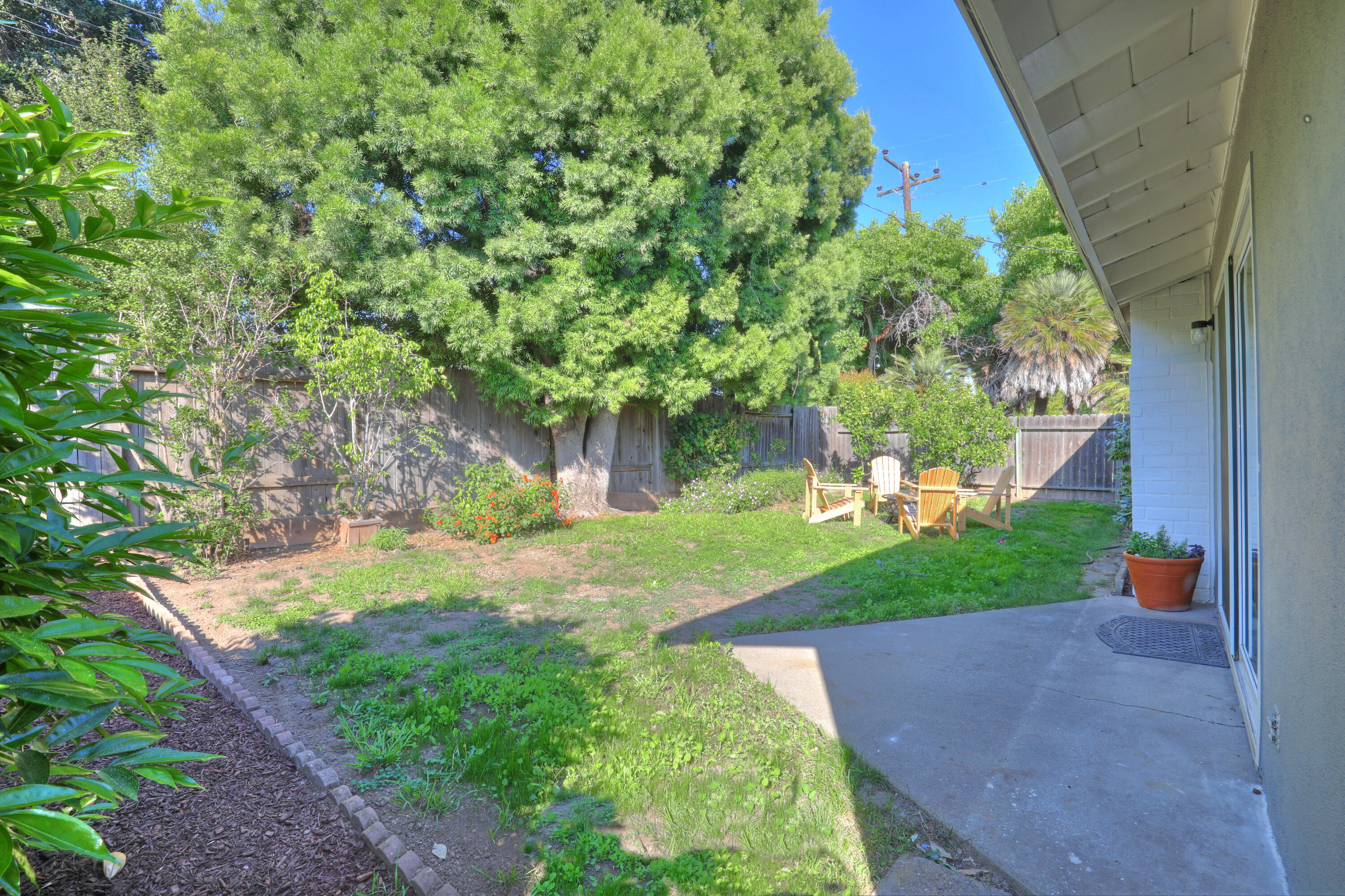 3704 Capri Drive Santa Barbara, CA 93105 - Photo 33 of 33 a view of a yard with plants and a fountain