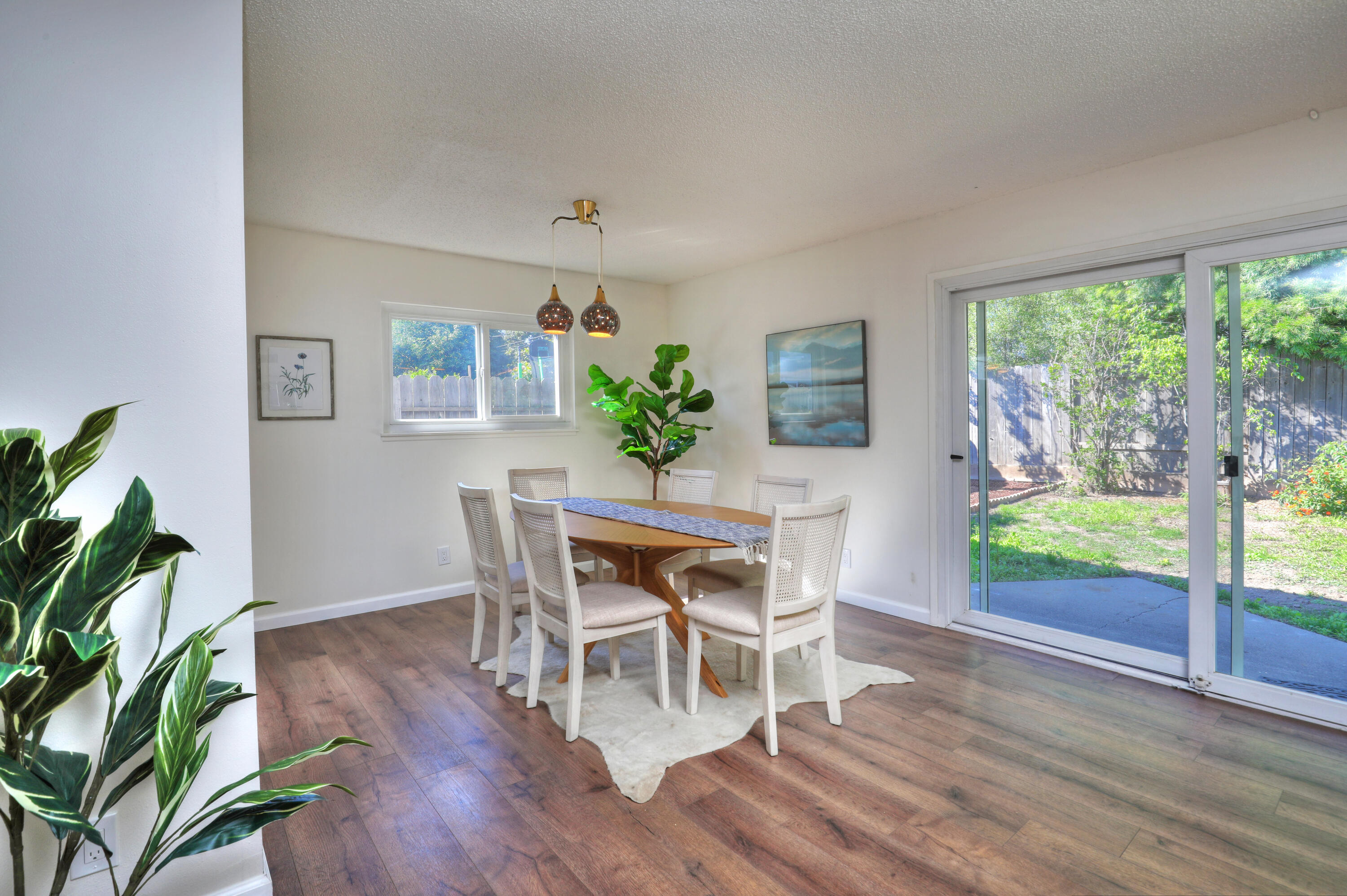3704 Capri Drive Santa Barbara, CA 93105 - Photo 9 of 33 a dining room with furniture and wooden floor