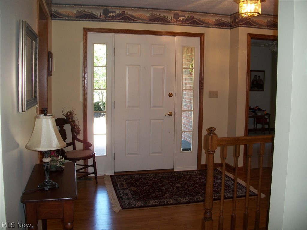 8488 Massillon Road Navarre, OH 44662 - Photo 2 of 25 Solid wood flooring in entry greets guests