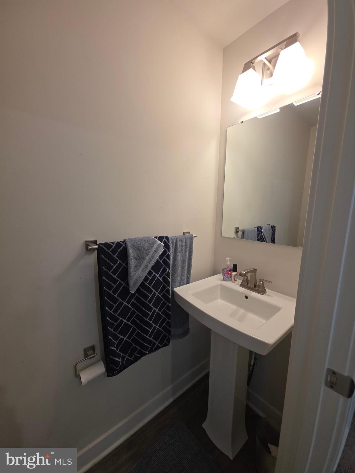 14510 Hunts Farm Road Brandywine, MD 20613 - Photo 31 of 74 a bathroom with a sink a mirror and a vanity