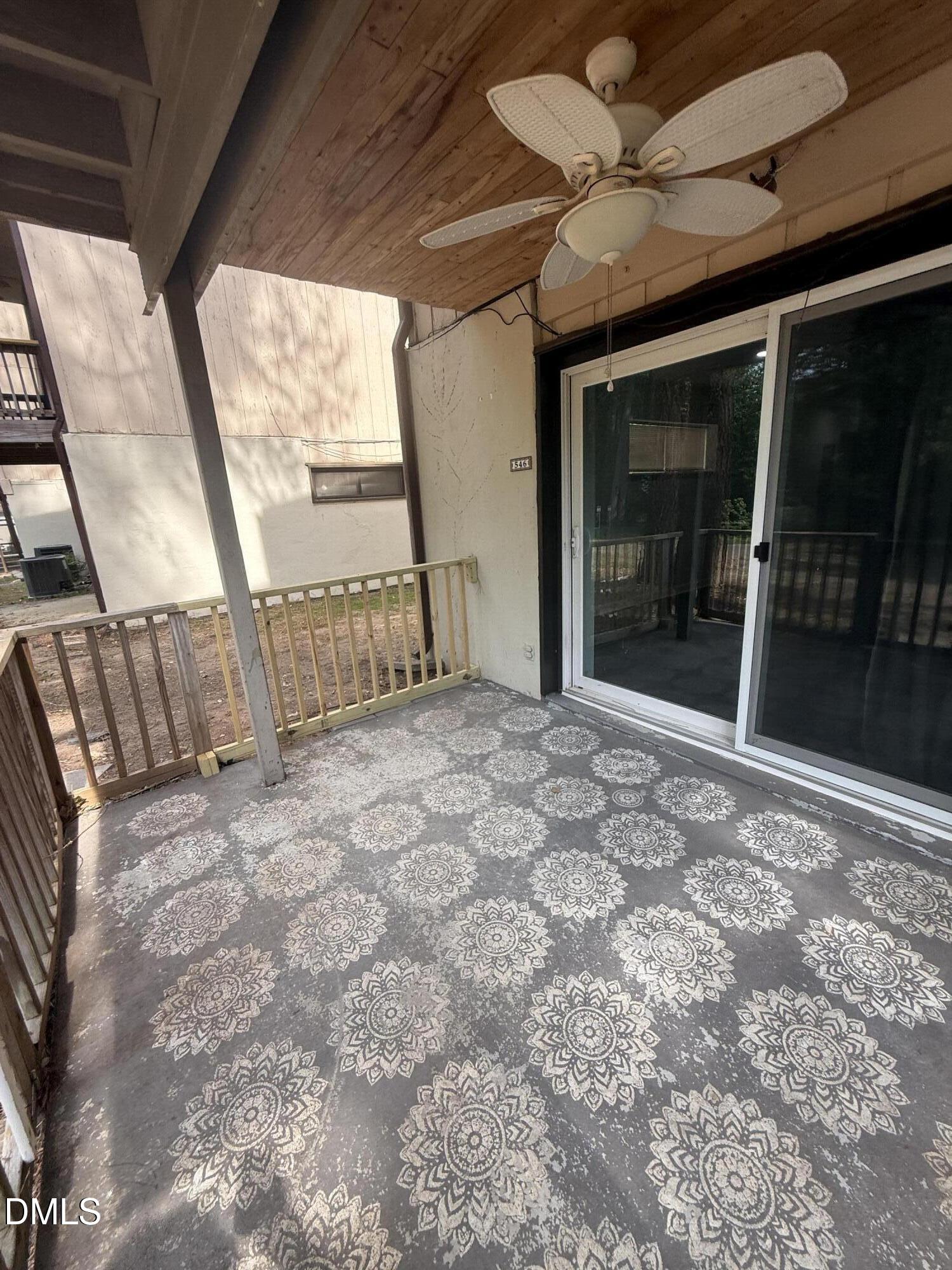 546 Pine Ridge Place Raleigh, NC 27609 - Photo 21 of 28 a view of an empty room with a balcony
