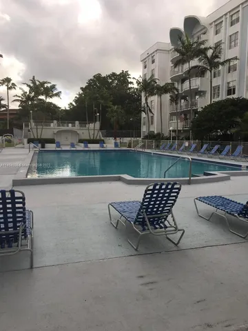 a view of a park with large trees