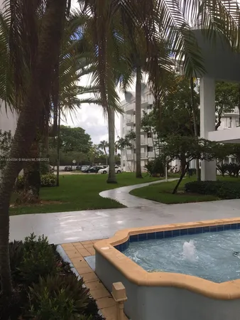 a view of a water fountain in front of the house