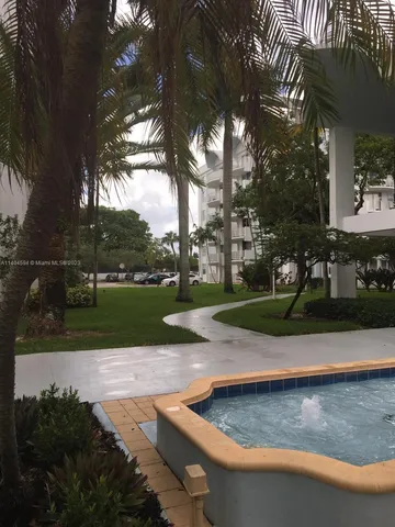 a view of a water fountain in front of the house
