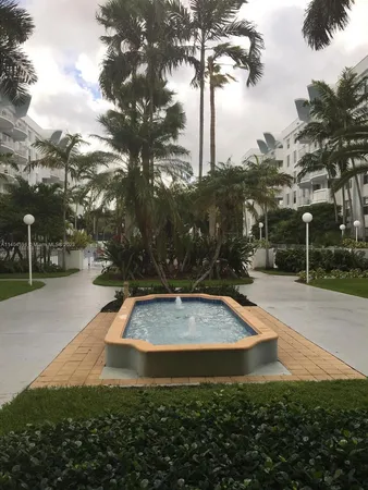a view of a park with large trees