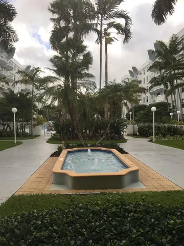 a view of a park with large trees