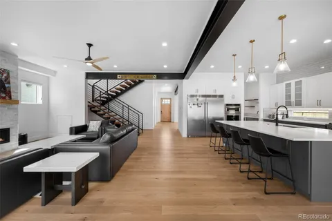 a large kitchen with a table and chairs