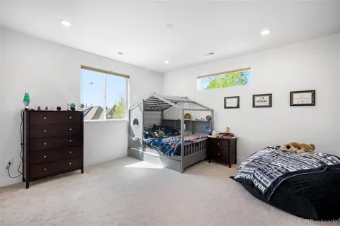 a bedroom with a bed and a cabinets