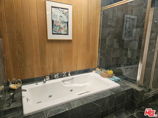a bathroom with a tub and a sink