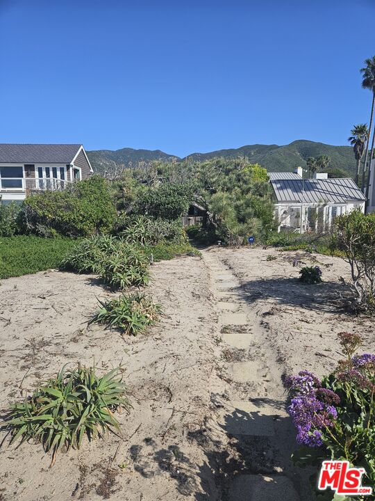 30838 Broad Beach Road Malibu, CA 90265 - Photo 21 of 21 a view of a road with a building in the background