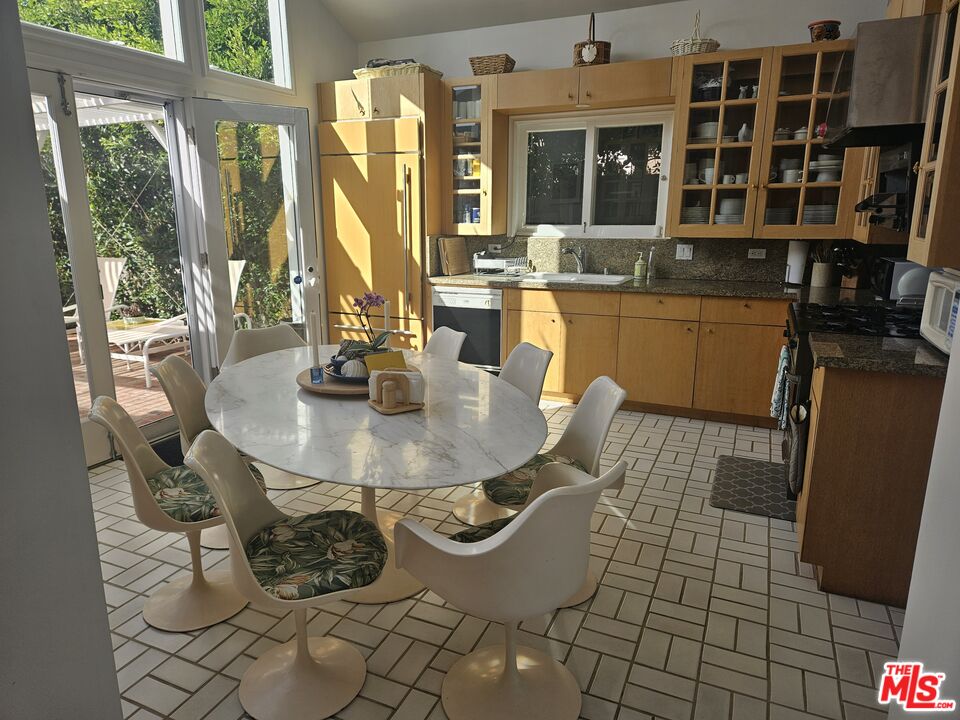30838 Broad Beach Road Malibu, CA 90265 - Photo 5 of 21 a dining room with furniture and large windows