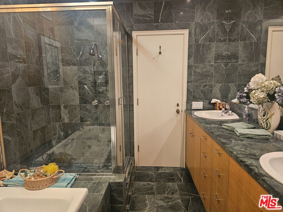 30838 Broad Beach Road Malibu, CA 90265 - Photo 10 of 21 a bathroom with a granite countertop sink a toilet and shower