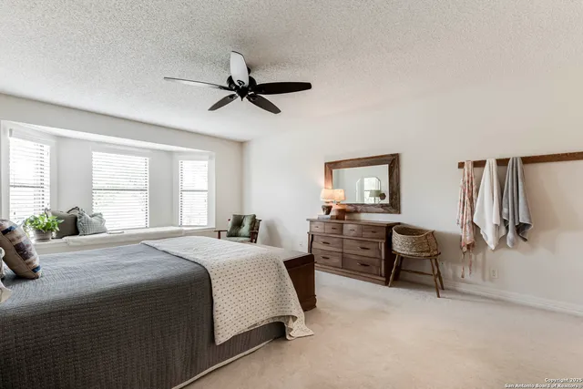 a bedroom with a bed and furniture