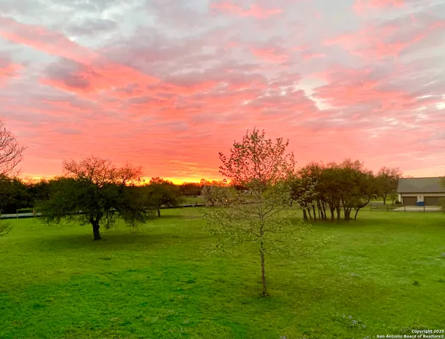 a view of a golf course with a lake