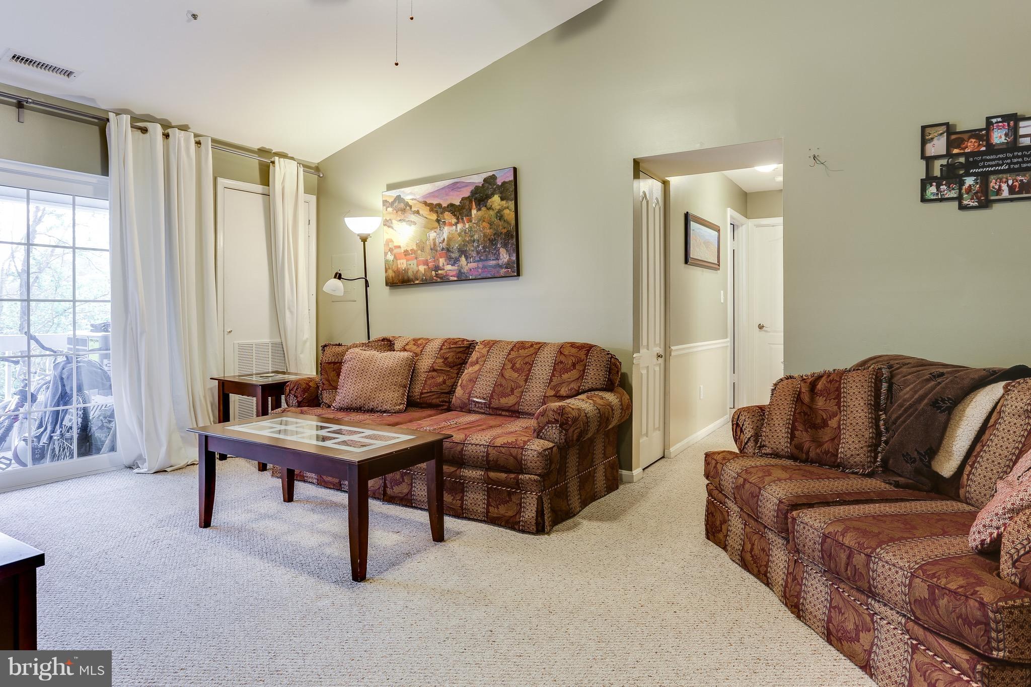 8589 Falls Run Road, Unit K Ellicott City, MD 21043 - Photo 3 of 17 Family Room with vaulted ceiling