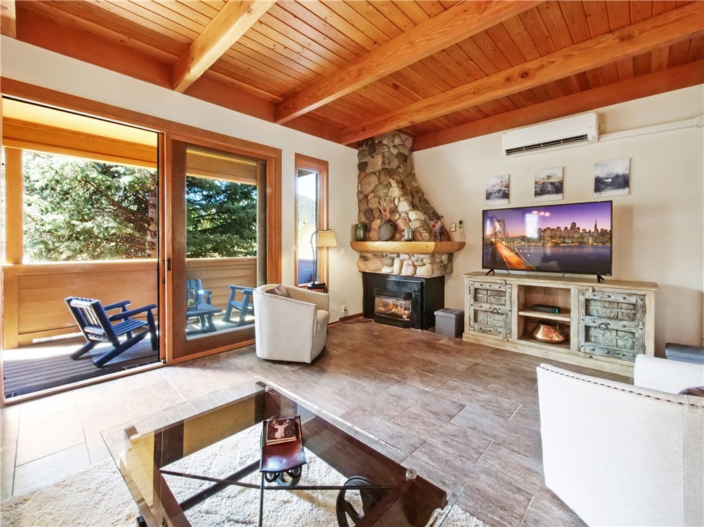 530 Tennis Club Road, Unit 1330 Keystone, CO 80435 - Photo 5 of 35 Large Living Room w/ new slate floors, A/C And Walk Out Deck
