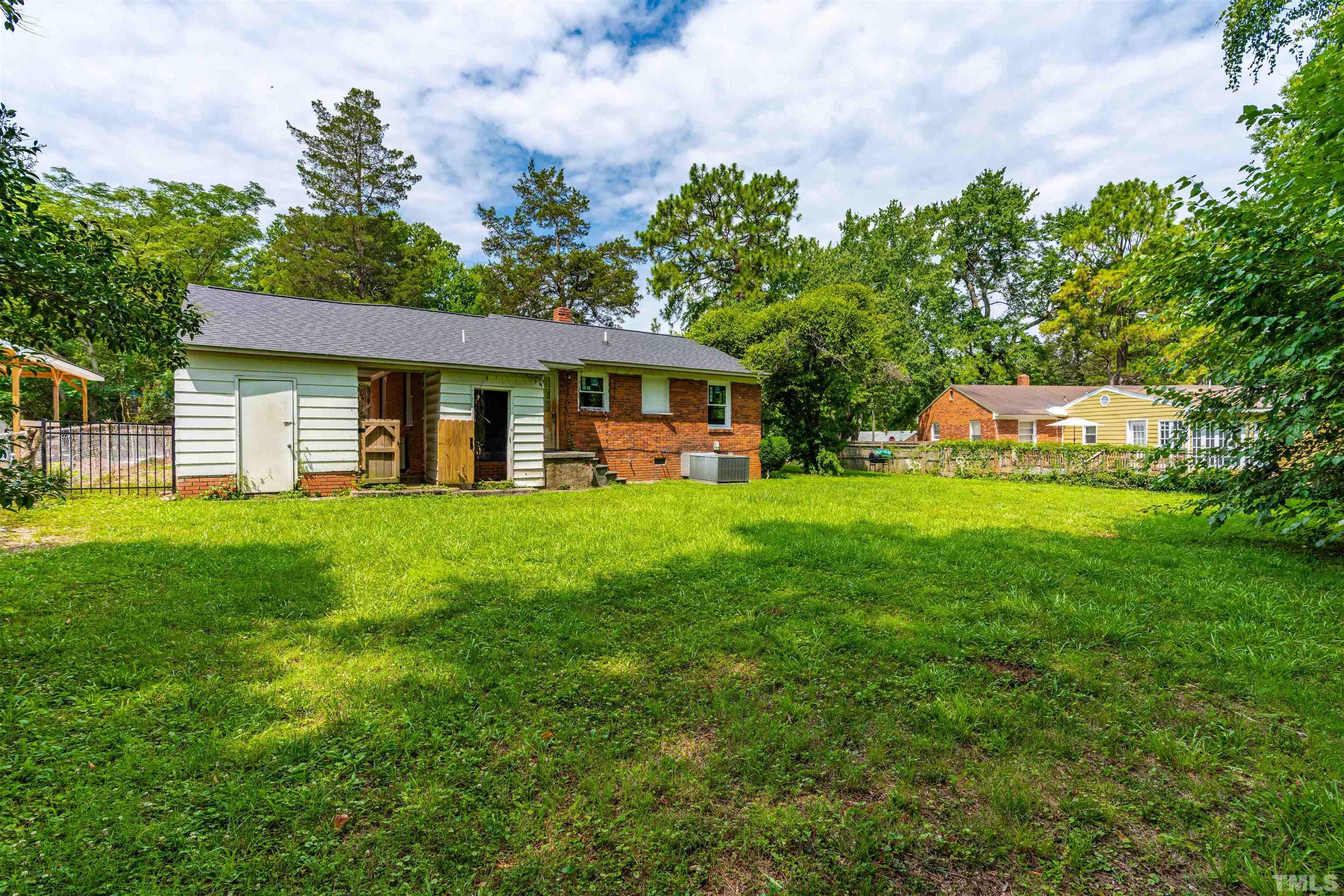 405 Lamont Street Raleigh, NC 27610 - Photo 8 of 16 a front view of house with yard and green space