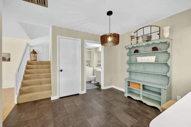 a kitchen that has a lot of cabinets in it and appliances