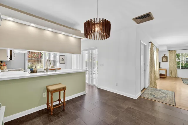 a kitchen with stainless steel appliances a stove refrigerator sink and microwave