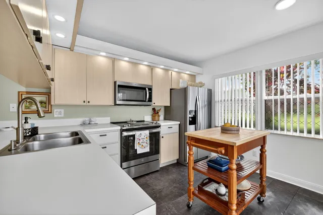 a kitchen with a stove and a sink