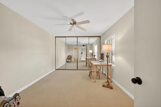 a bathroom with double vanity and a mirror