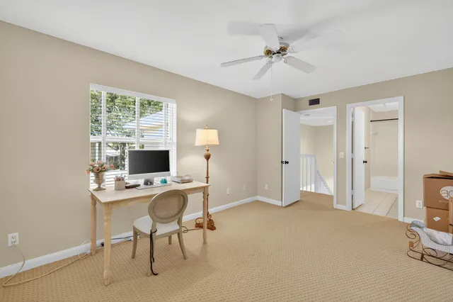 a bathroom with a shower a mirror and a sink