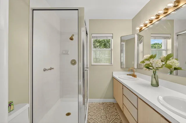 a bathroom with a sink a toilet and vanity
