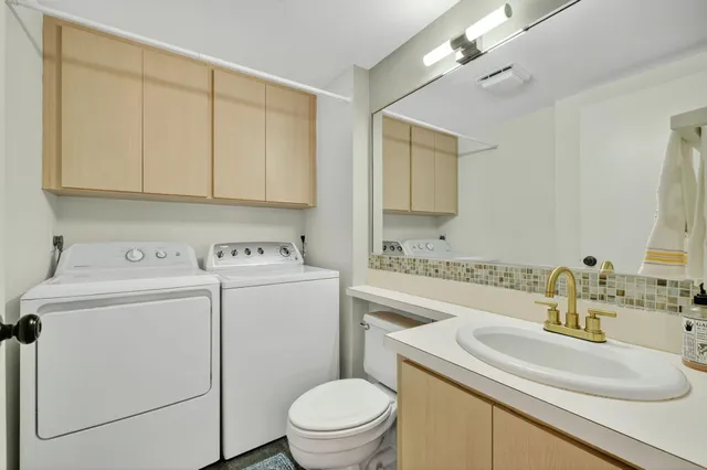 an aerial view of a house with a swimming pool and outdoor seating