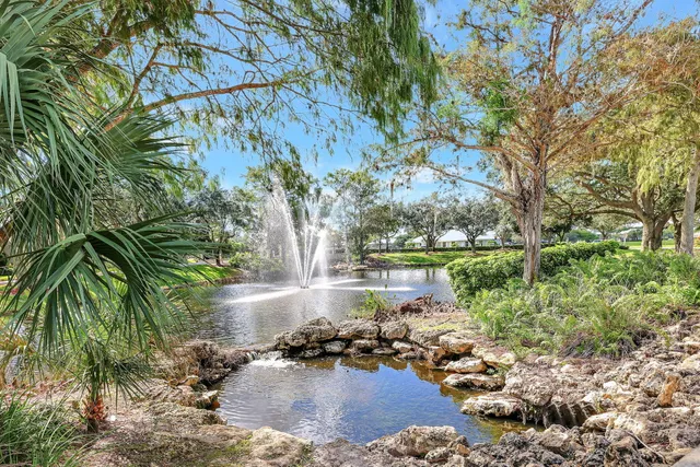 a view of swimming pool with trees in the background