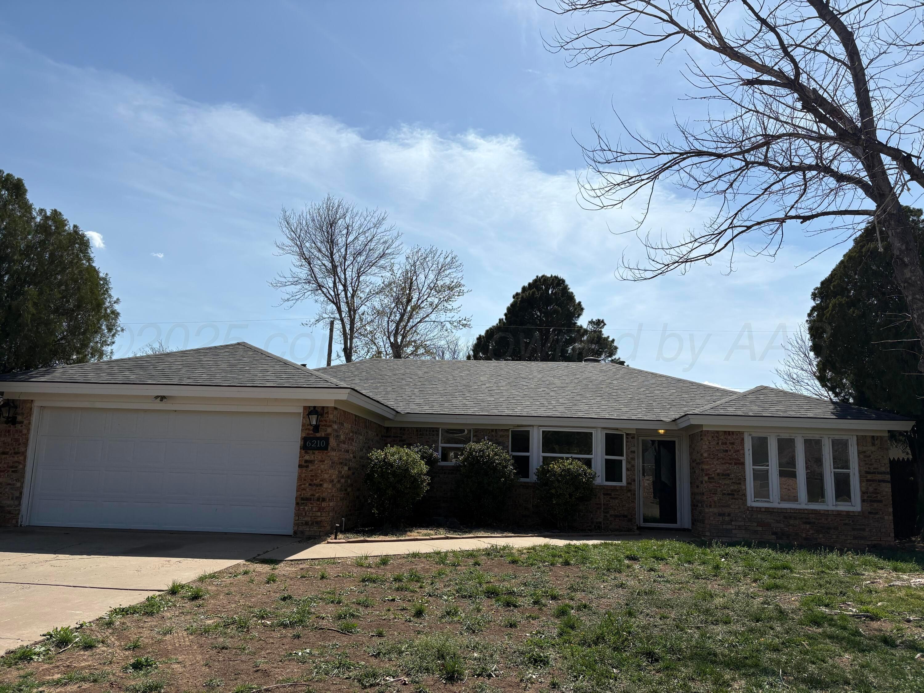 6210 Rutgers Street Amarillo, TX 79109 - Photo 1 of 13 a front view of a house with a yard