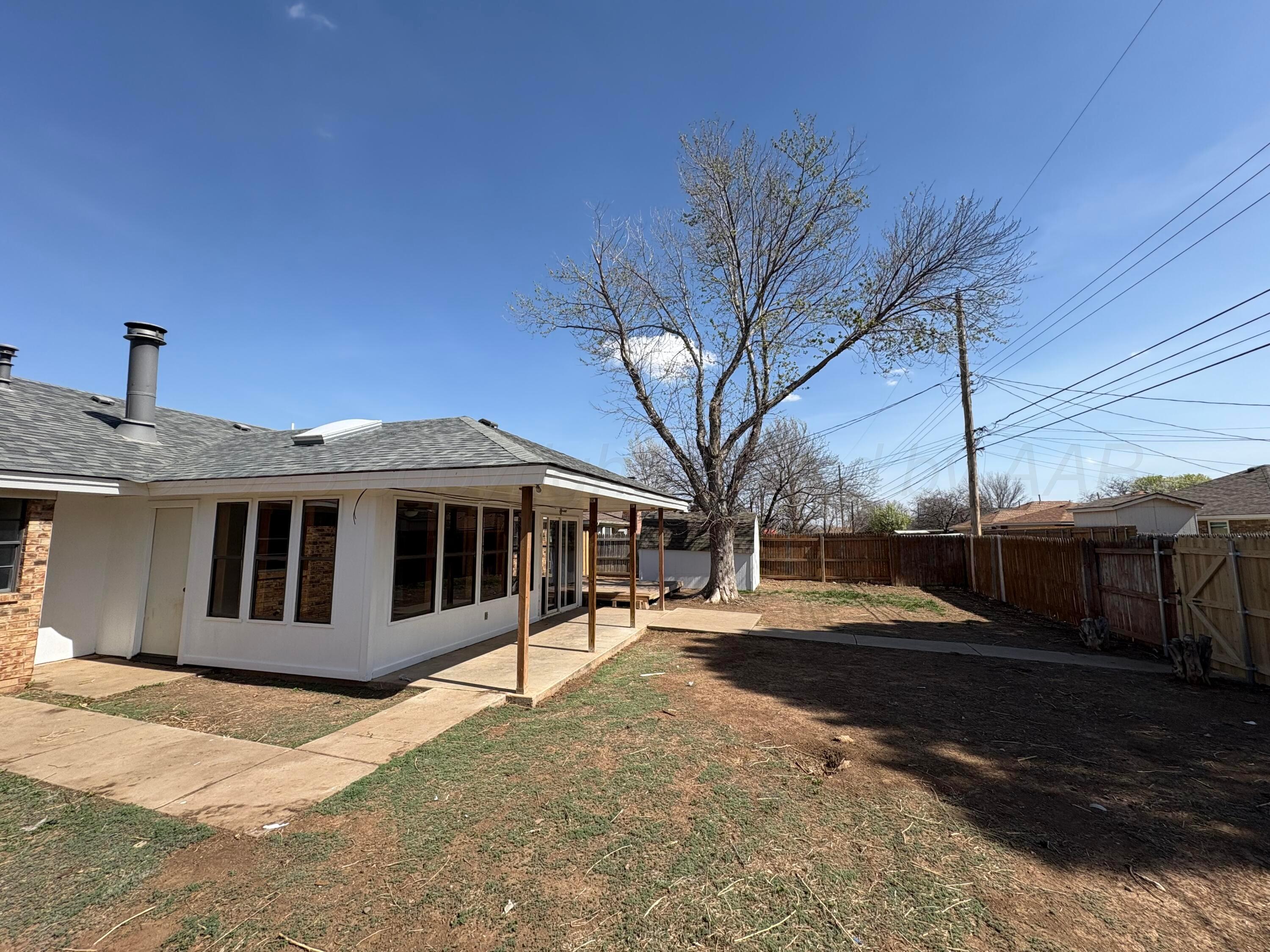 6210 Rutgers Street Amarillo, TX 79109 - Photo 13 of 13 a view of a house with a yard