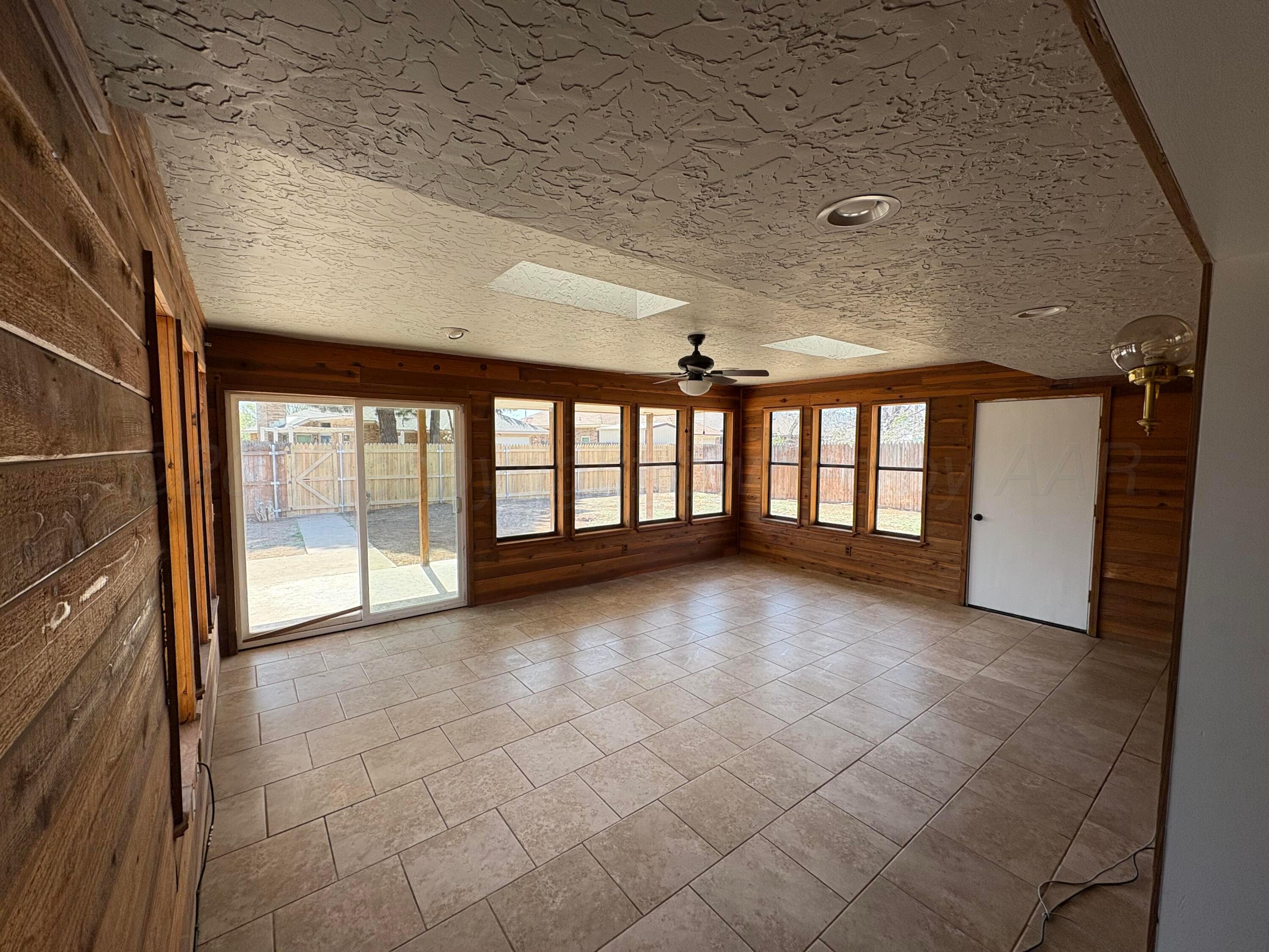 6210 Rutgers Street Amarillo, TX 79109 - Photo 3 of 13 a view of an empty room with a window